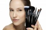 Portrait Of The Beautiful Woman With Make-up Brushes Stock Photo