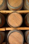 Horizontal Wooden Wine Barrels In Cellar Shelf Stock Photo