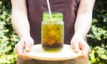 Barista Serving Iced Black Coffee With Vintage Filter Effect Stock Photo