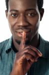 Silence Gesture By A Young Guy, Closeup View Stock Photo