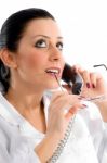 Lady Doctor Talking Over Phone Stock Photo