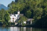 Castle Schloss On The Shoreline Of Lake Hallstatt Stock Photo