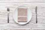 Empty Plate Napkin Fork Knife Silverware White Wooden Table Background Stock Photo