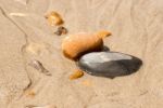 Pebbles In The Sand Central Stock Photo