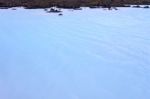 Milky White And Blue Water Between The Lava Stones Covered With Moss Stock Photo