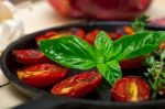 Baked Cherry Tomatoes With Basil Anf Thyme Stock Photo