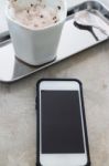 Hot Chocolate Cup And Smart Phone Stock Photo