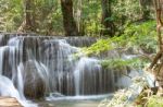 The Water Flowing Over Rocks And Trees Down A Waterfall At Huay Mae Khamin Waterfall National Park ,kanchana Buri In Thailand Stock Photo