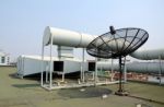 Industrial Air Conditioner And Satellite Dish Stock Photo