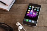 Iphone 6 And Ios Application On Wood Desk Stock Photo