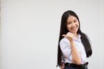 Portrait Of Thai High School Student Uniform Beautiful Girl Pointing Stock Photo