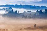 Autumn Foggy Sunrise In Mountains. Alpine Village On September H Stock Photo