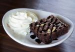 Brownie Cake With Whipped Cream Stock Photo