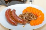 Beef Sausages Cooked On Iron Skillet Stock Photo