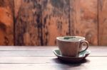 Cup And Saucer On Wooden Stock Photo