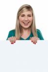 Smiling Teen Girl Standing Behind Blank Whiteboard Stock Photo