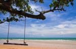 Wood Swing On Beach Stock Photo