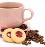 Cup Of Freshly Brewed Coffee And Some Strawberry Cookies Stock Photo