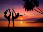 Silhouette Of Yoga Girls In Sunset Stock Photo