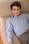 Man Relaxing On The Couch Stock Photo