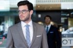 Two Young Executives Arriving At The Hotel Stock Photo