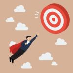 Businessman Super Hero Fly To Big Target Stock Photo