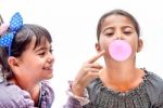 Portraits Of Beautiful Little Girls Blowing Bubbles Stock Photo