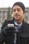 Man With Mobile Phone In Hands Stock Photo