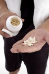 Hand With Pills And Bottle Stock Photo