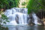 The Water Flowing Over Rocks And Trees Down A Waterfall At Huay Mae Khamin Waterfall National Park ,kanchana Buri In Thailand Stock Photo