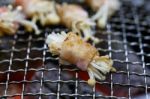 Grilling Bacon Wrapped With Needle Mushroom Stock Photo