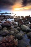 Beautiful Seascape Of Wave And Rock And  Sunset Stock Photo