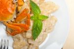 Italian Gnocchi With Seafood Sauce With Crab And Basil Stock Photo