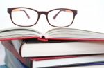 Eyeglasses On Book Stacks Stock Photo