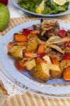 Oven Baked Meat With Potatoes, And Watercress Salad Stock Photo