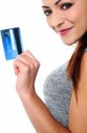 Fashionable Young Girl Holding Up A Credit Card Stock Photo