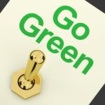 Go Green Text With Golden Switch Stock Photo