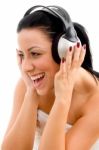 Front View Of Woman Enjoying Music On An Isolated White Background Stock Photo