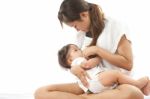 Mother Is Breast Feeding For Her Baby Stock Photo