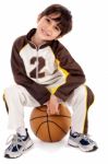 Cute Kid Sitting On The Ball Stock Photo