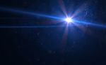 Abstract Digital Lens Flare In Black Background Stock Photo