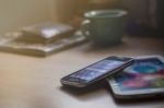 Mobile Phones On The Desk Stock Photo