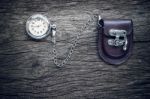 Pocket Watch On Old Wooden Background Stock Photo