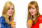 Two Teenage Girls Drinking Soft Drinks Stock Photo