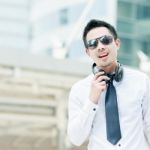 Handsome Young Man Smiling Outdoors Stock Photo