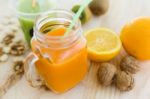 Orange Juice In Glass, Nuts And Fresh Fruits On Wooden Backgroun Stock Photo