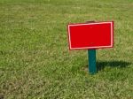 Sign On Grass Stock Photo