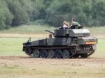 People Enjoying A Ride In An Armoured Car At Dunsfold Airfield Stock Photo