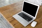 Blank Screen Laptop Computer On Wood Table Stock Photo