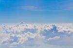 Clouds And Sky Blue, Viewed From An Airplane Window Stock Photo